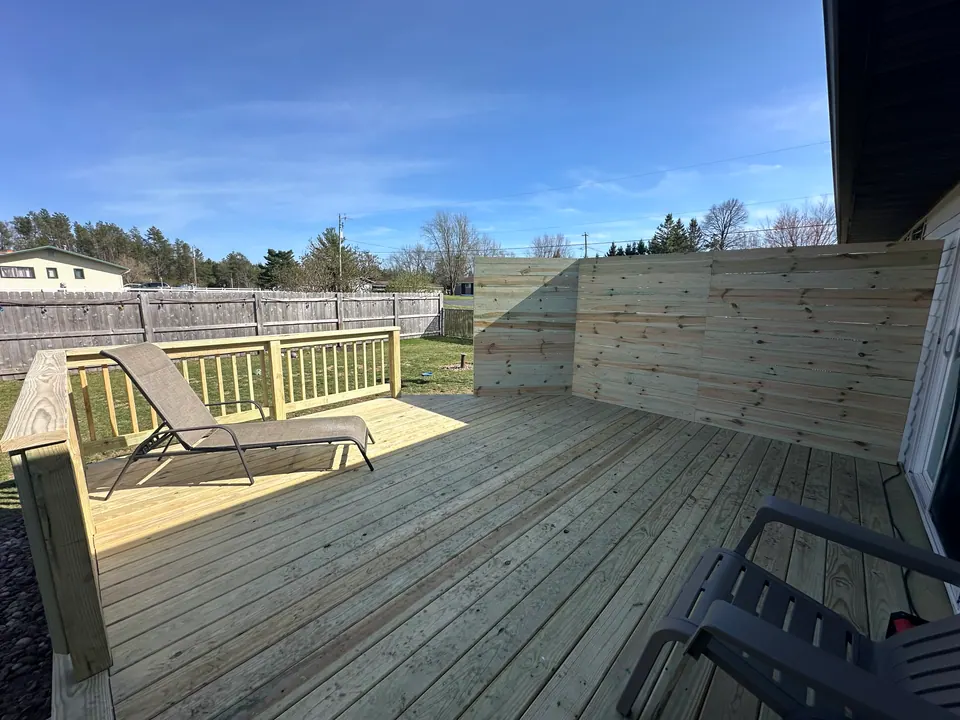 Wood deck with privacy screen wall